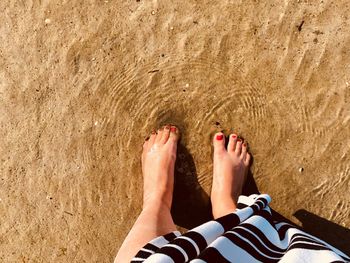 Low section of person legs on beach