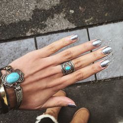Cropped hand of fashionable woman