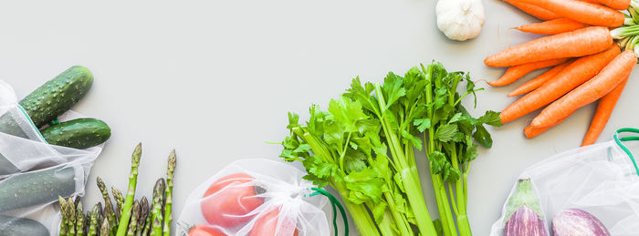 High angle view of vegetables on table against white background