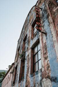 Low angle view of old building against clear sky