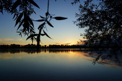 Scenic view of lake against sky during sunset