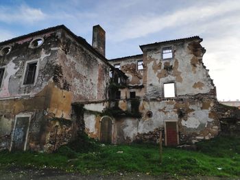 Low angle view of old building against sky