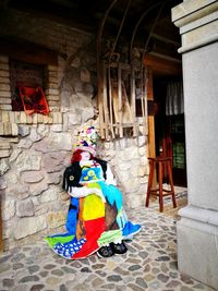 Man wearing multi colored umbrella