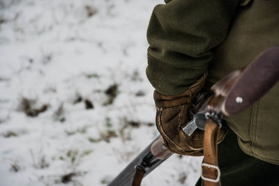 Close-up of hunter in snow