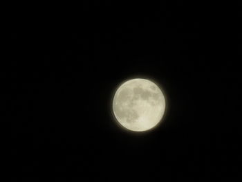 Low angle view of moon against sky at night