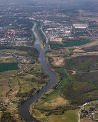 High angle view of river amidst buildings in city