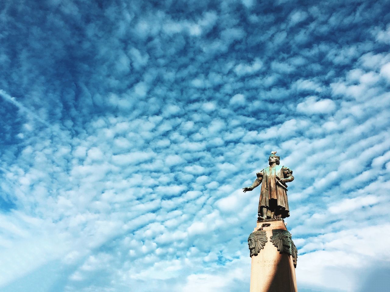 sky, low angle view, cloud - sky, cloud, cloudy, blue, lifestyles, part of, leisure activity, day, men, outdoors, standing, person, unrecognizable person, nature, sunlight