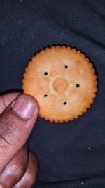 High angle view of hand holding bread