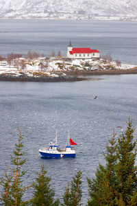 Boats in sea against sky