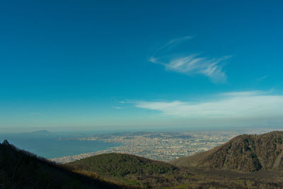 Scenic view of landscape against blue sky