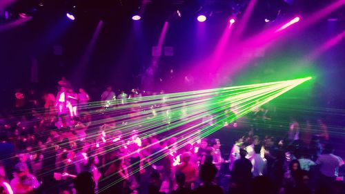 Rear view of people enjoying music concert