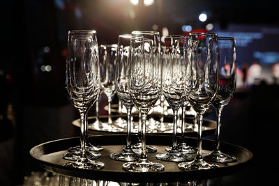 Empty champagne glasses on serving tray.