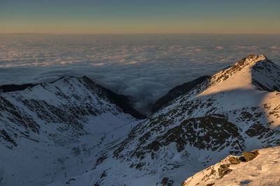 Scenic view of snowcapped mountains against sky during winter, fagaras mountains