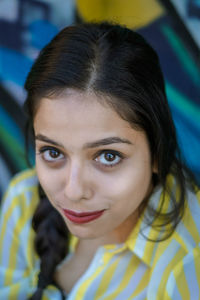 Close-up portrait of smiling young woman