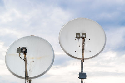 Low angle view of satellite dish against sky