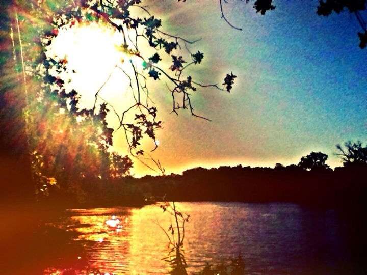 water, sunset, sun, reflection, tranquility, scenics, sky, tranquil scene, beauty in nature, silhouette, nature, waterfront, idyllic, tree, sea, lake, orange color, sunlight, rippled, horizon over water