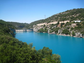 Scenic view of blue sea against clear sky
