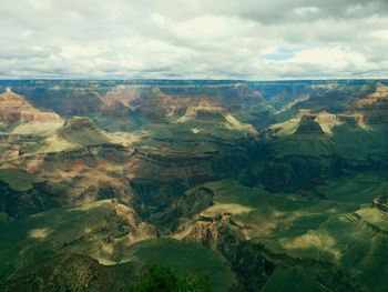 Scenic view of landscape against cloudy sky