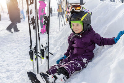 Portrait of woman skiing on snow