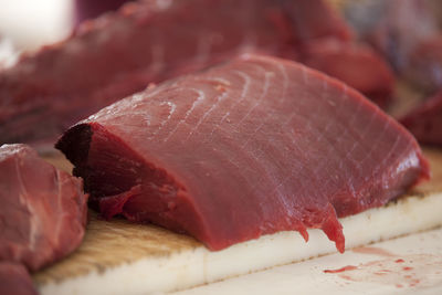 Close-up of tuna fish on cutting board