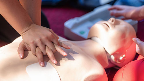 Cardiopulmonary resuscitation, first aid training on a cpr dummy.