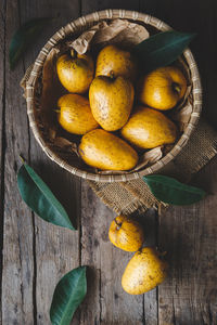 High angle view of fruits in basket on table