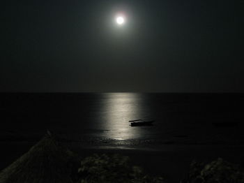 Scenic view of sea against sky at night