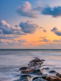 Scenic view of sea against sky during sunset