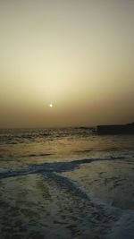 Scenic view of sea against sky at sunset