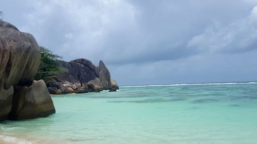 View of calm sea against cloudy sky