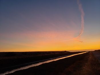 Scenic view of silhouette landscape against sky during sunset