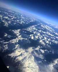 Aerial view of dramatic landscape against sky