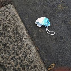 High angle view of abandoned umbrella on footpath