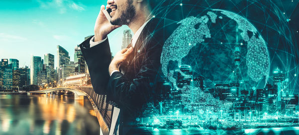 Digital composite image of man and buildings against sky in city