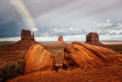 Dark clouds and a rainbow over the monument valley, arizona