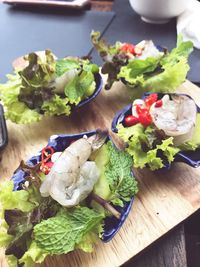 High angle view of vegetables in plate on table