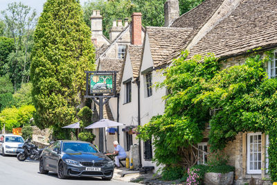 Cars on street by buildings in city