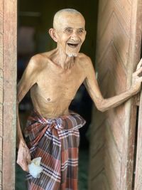 Portrait of smiling man standing outdoors