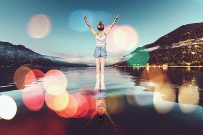 Rear view of woman standing in water