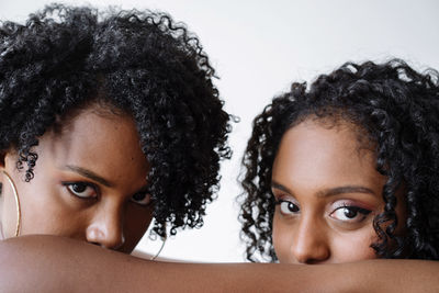 Portrait of two women of color hugging each other