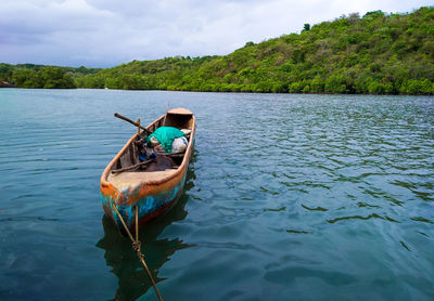 Boat in lake against sky