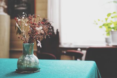 Close-up of flower pot on table at home