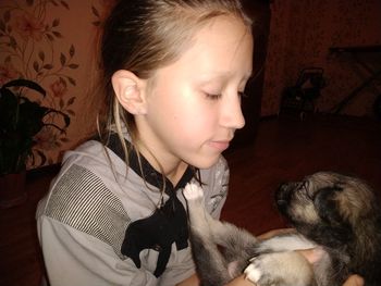 Baby girl with dog at home