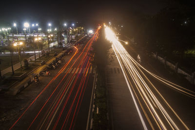 High angle view of light trails on road at night