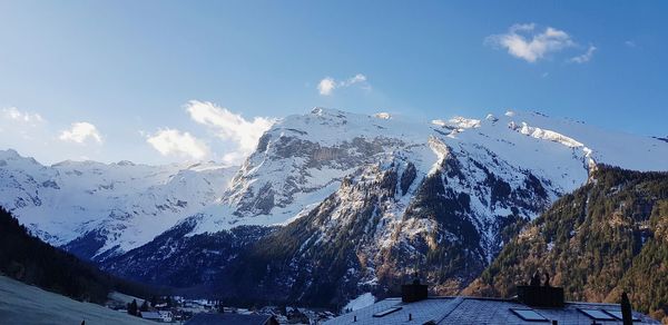 Panoramic view of snowcapped mountains against sky