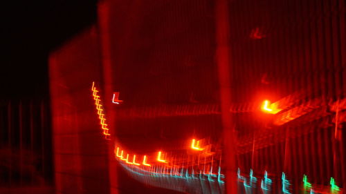 Close-up of illuminated red lights at night