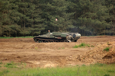 Side view of vintage car on field