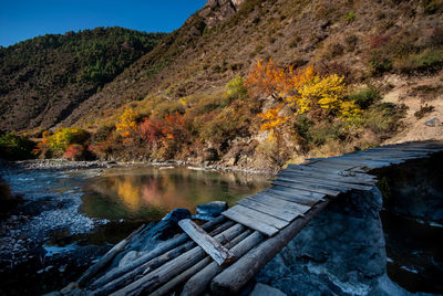 Scenic view of lake against mountain during autumn