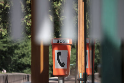 Close-up of telephone sign in city