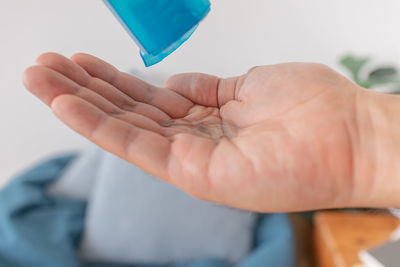 Midsection of person holding paper